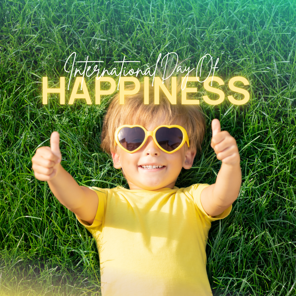 International Day of Happiness, happy child, with yellow top.