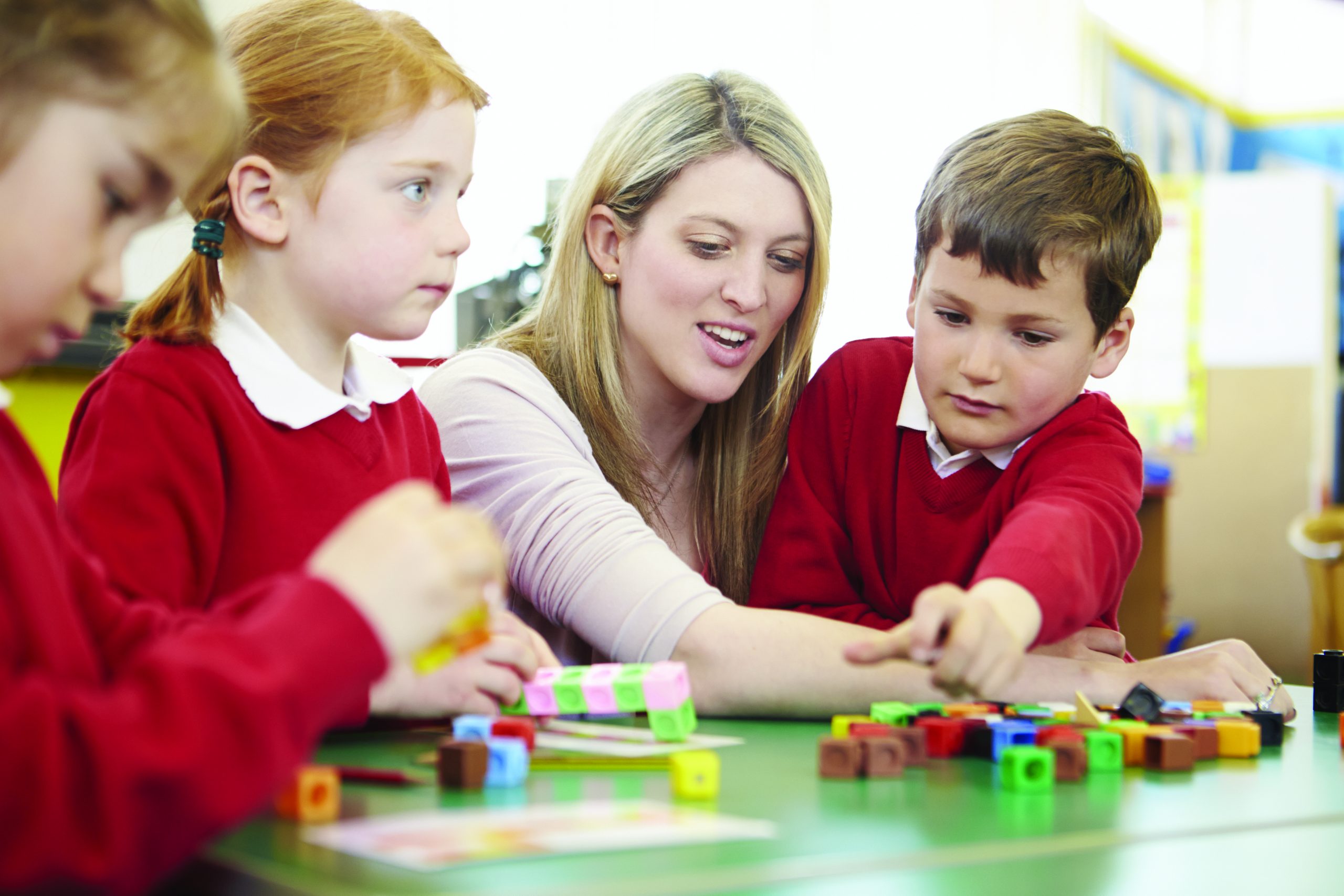 Schools Mutual Services - Primary Children learning with teaching assistant